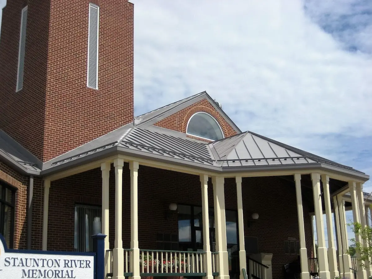 Skilled roofing craftsmen working on a residential roof in Oak Grove - Pine Banks